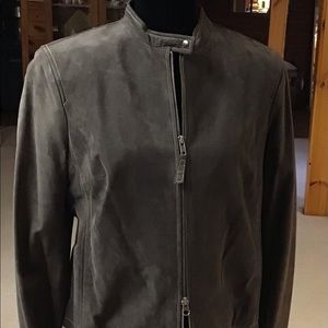 A soft suede brown jacket. It’s zips up front with a short stand up collar.